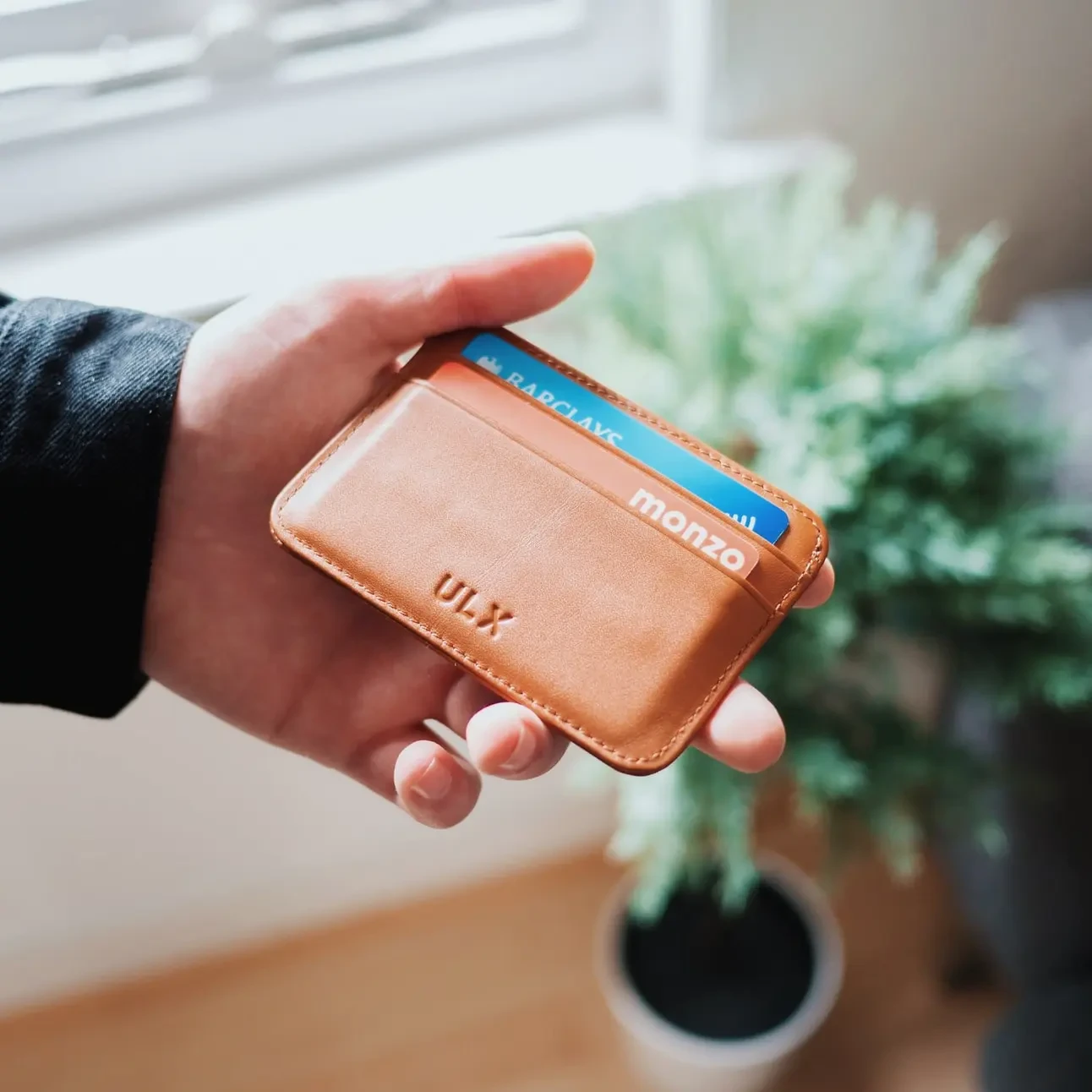 hand showing wallet