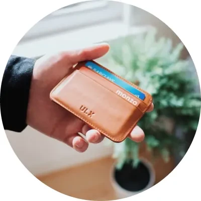 hand holding leather-like wallet